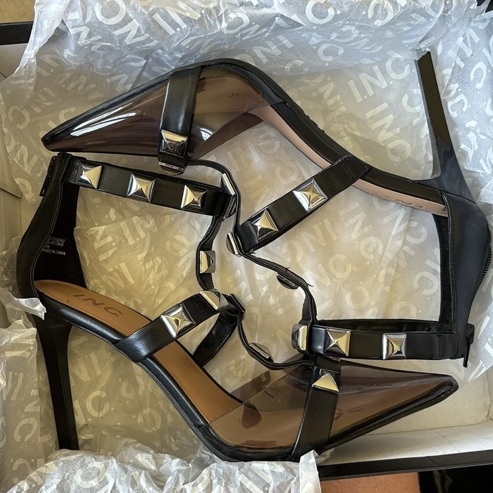Brand New INC Syndia Pyramid Studded Black Stiletto Heels Clear Pointed Toe Cage